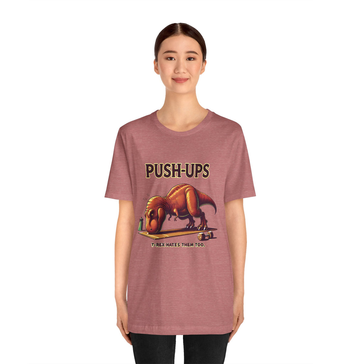 Rose short-sleeve T-shirt featuring a dinosaur push-ups graphic on the chest