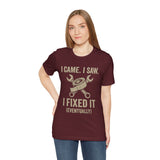 Maroon graphic T-shirt with “I came. I saw. I fixed it (eventually)” text and tools icon