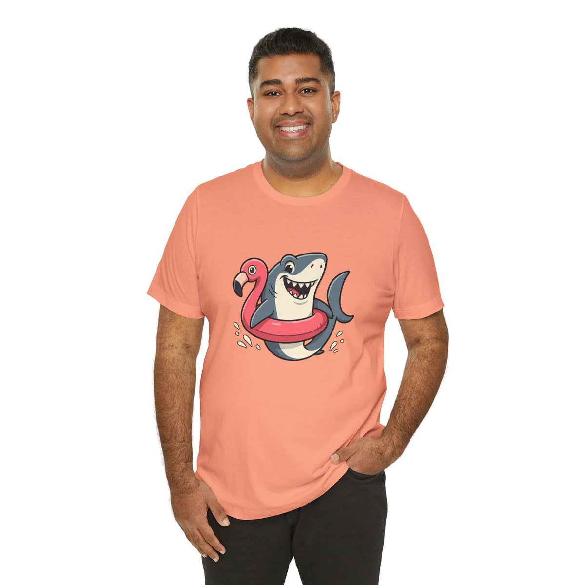 Coral crewneck T-shirt with shark and flamingo floatie graphic, smiling model
