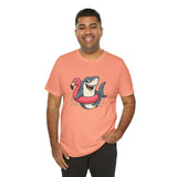 Coral crewneck T-shirt with shark and flamingo floatie graphic, smiling model