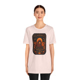 Light pink unisex T-shirt with centered orange pumpkin alien spice-life graphic