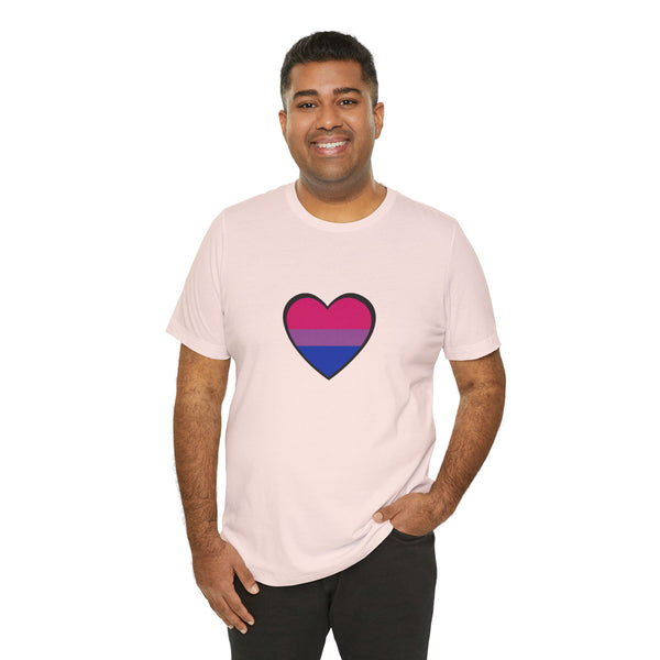 Soft pink Pride heart t-shirt with rainbow heart graphic on front