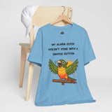 Blue parrot alarm T-shirt on hanger, conure graphic with 'snooze button' slogan