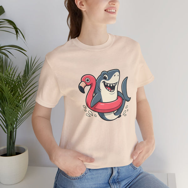 Cream crew-neck t-shirt with shark and flamingo float graphic, worn by woman