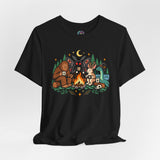 Black crewneck T-shirt with colorful campfire cryptids graphic centered on chest