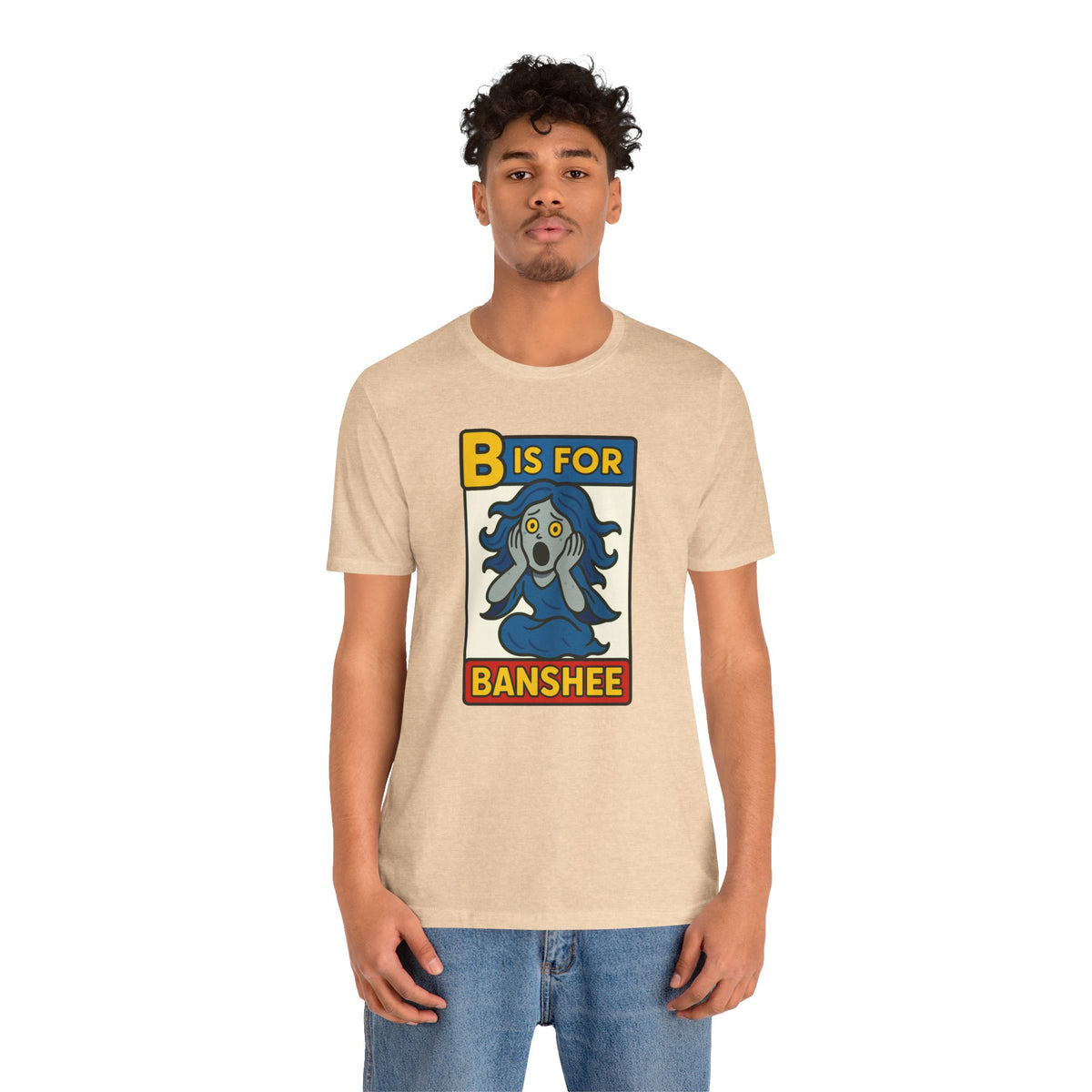 Beige crew-neck T-shirt featuring a “B is for Banshee” monster alphabet graphic