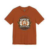 Burnt orange crewneck t-shirt with pumpkin-spice themed badge graphic on the chest
