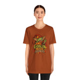Unisex t-shirt in burnt orange with colorful “Goblin Mode” seasonal print on chest.