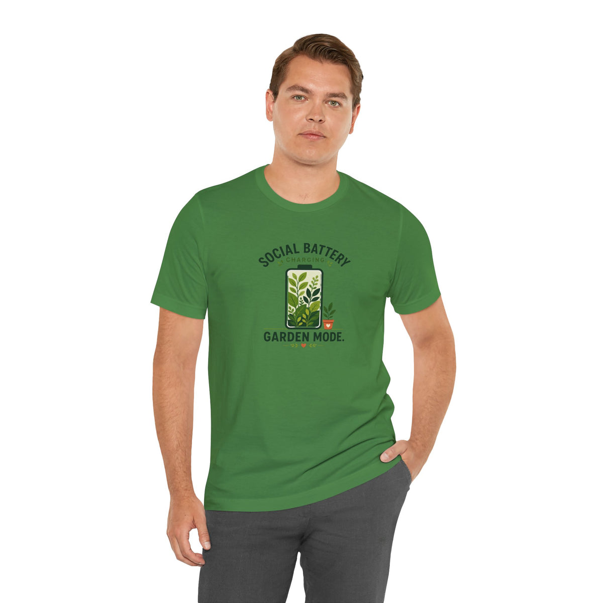 Green graphic T-shirt with centered “SOCIAL BATTERY” and “GARDEN MODE” garden design