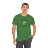 Green graphic T-shirt with centered “SOCIAL BATTERY” and “GARDEN MODE” garden design