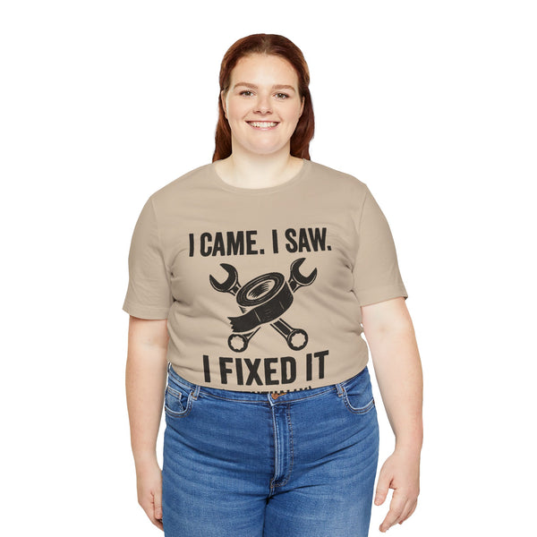 Beige crewneck T-shirt with bold repair quote and crossed tools icon on front