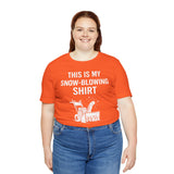 Orange crew-neck T-shirt with “This is my snow-blowing shirt” graphic on model