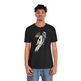Black crewneck T-shirt on model with white graphic of cloaked figure and hat