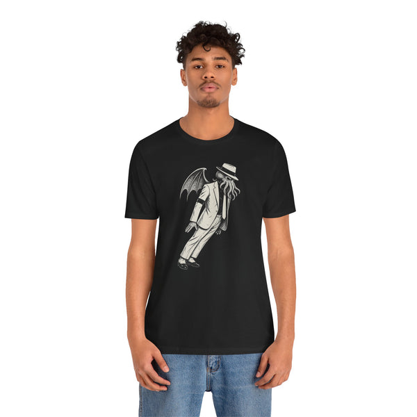 Black crewneck T-shirt on model with white graphic of cloaked figure and hat