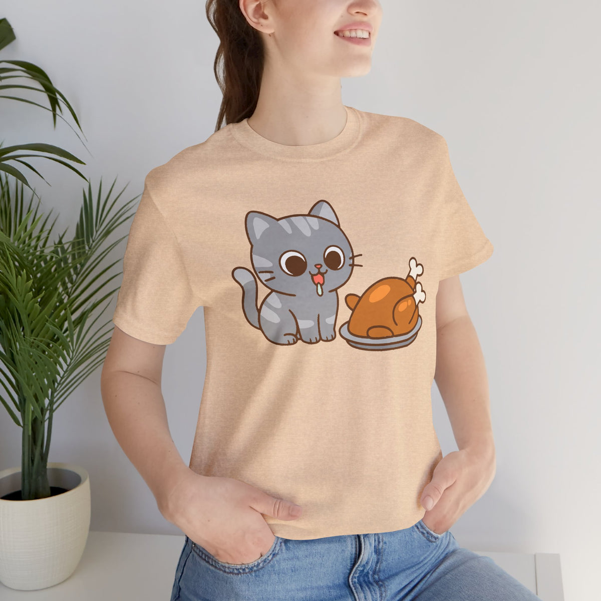 Beige crew-neck T-shirt with cartoon cat and turkey graphic on torso