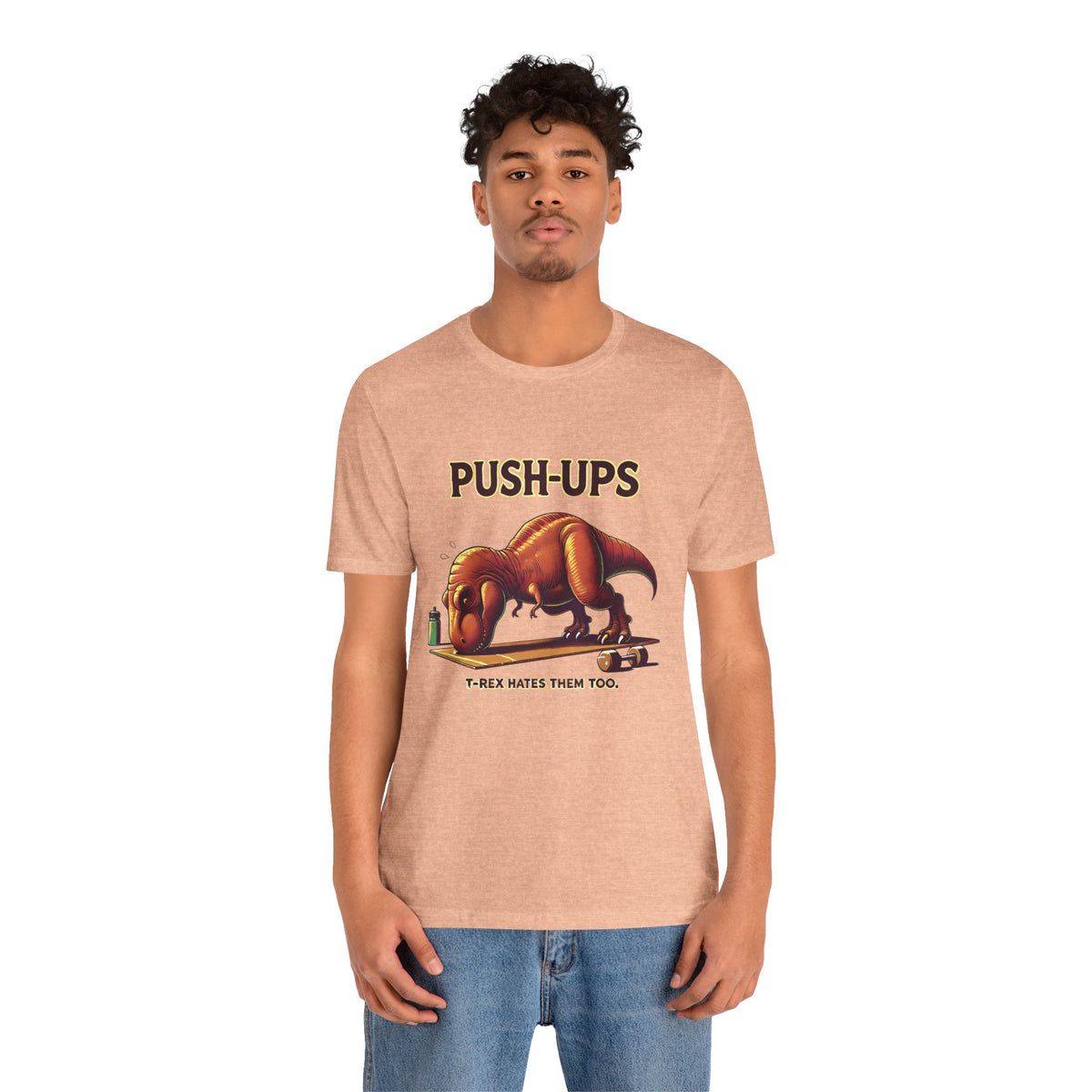 Beige crewneck T-shirt with 'PUSH-UPS' T-rex workout graphic, front view on model