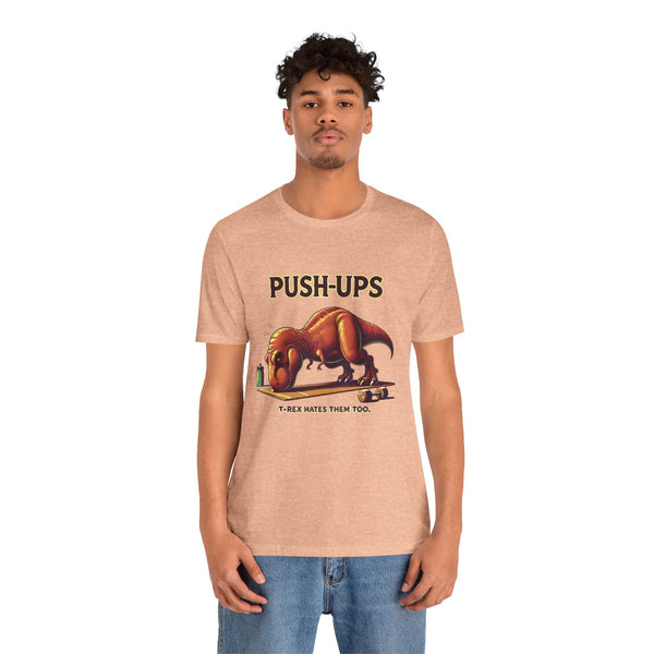 Beige crewneck T-shirt with 'PUSH-UPS' T-rex workout graphic, front view on model