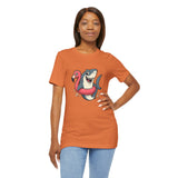 Orange crewneck T-shirt with shark and flamingo floatie graphic, model hands on hips.