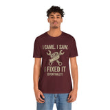 Maroon graphic tee showing “I came. I saw. I fixed it (eventually)” text and tools icon