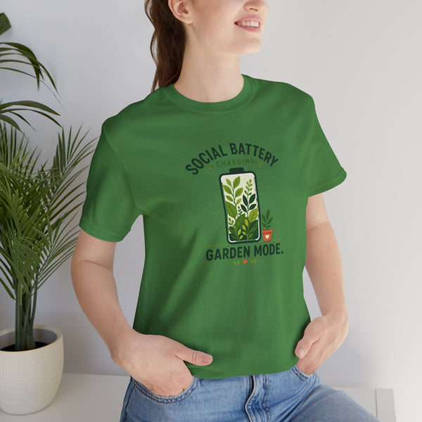 Green graphic T-shirt with “SOCIAL BATTERY” and “GARDEN MODE” garden design