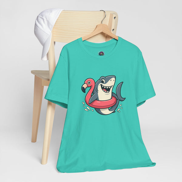Teal crew-neck T-shirt with shark and flamingo floatie graphic, flat on hanger