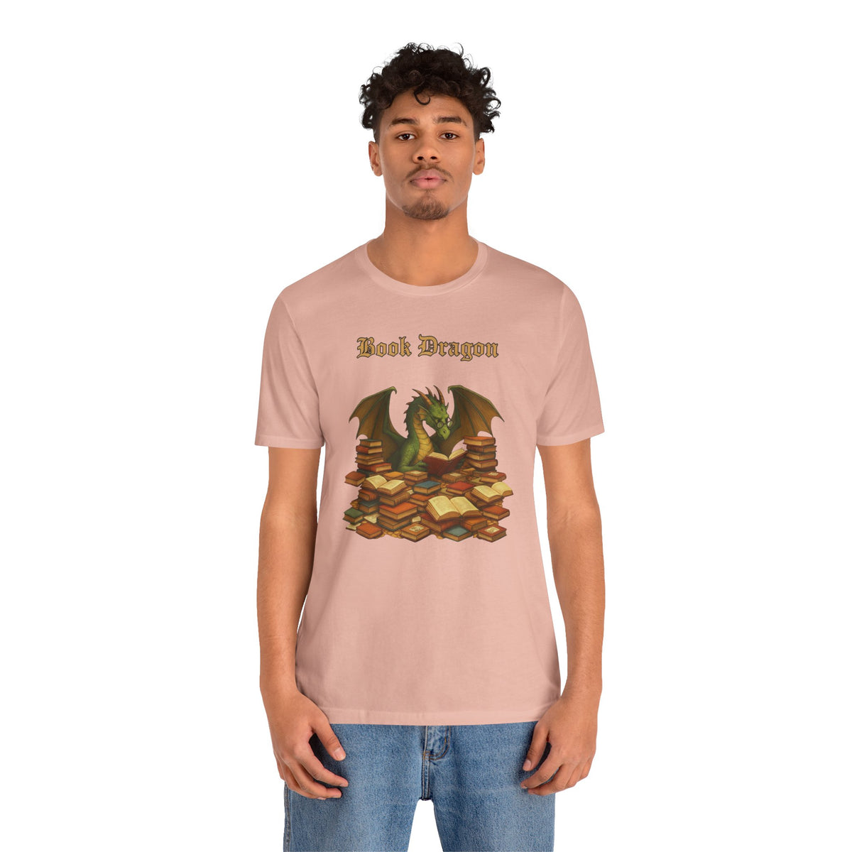 Pink crewneck t-shirt with dragon reading stacked books graphic, short sleeves