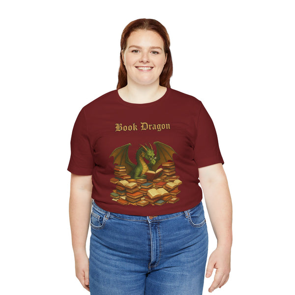 Burgundy crew-neck T-shirt with Book Dragon text and dragon sitting on book stacks
