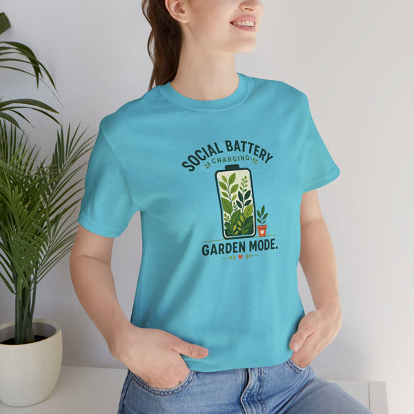 Blue graphic T-shirt with “SOCIAL BATTERY” and “GARDEN MODE” garden text and plants