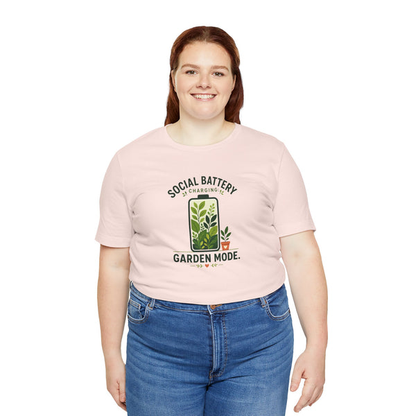 Soft pink T-shirt with 'Social Battery Charging' and 'Garden Mode' plant graphic