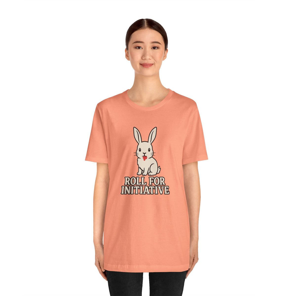 Peach crewneck T-shirt with bunny character and "Roll for Initiative" front design