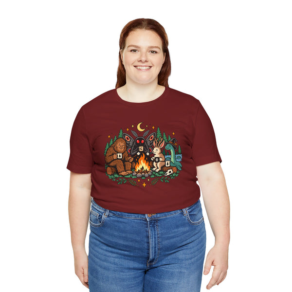 Burgundy campfire cryptid graphic t-shirt, front view on female model