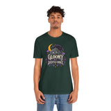 Dark green crew-neck t-shirt featuring colorful gothic moon and bat-like character graphic