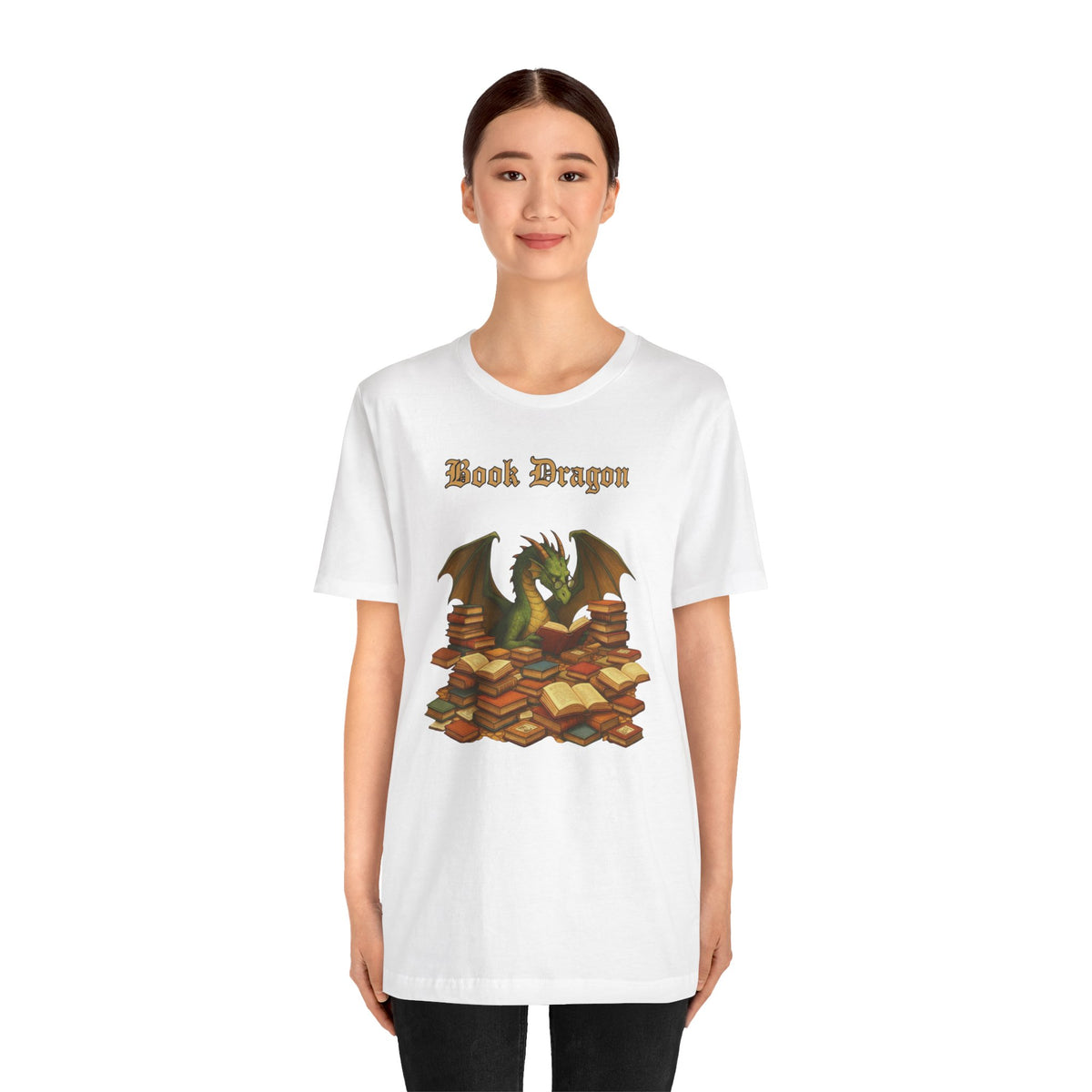 White crewneck t-shirt with front “Book Dragon” text and dragon on stacked books
