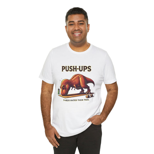White crew-neck graphic T-shirt with “PUSH-UPS” and T-Rex lifting illustration