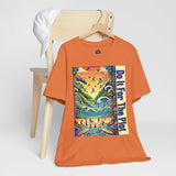 Orange crew-neck graphic t-shirt with colorful square artwork and vertical blue text panel