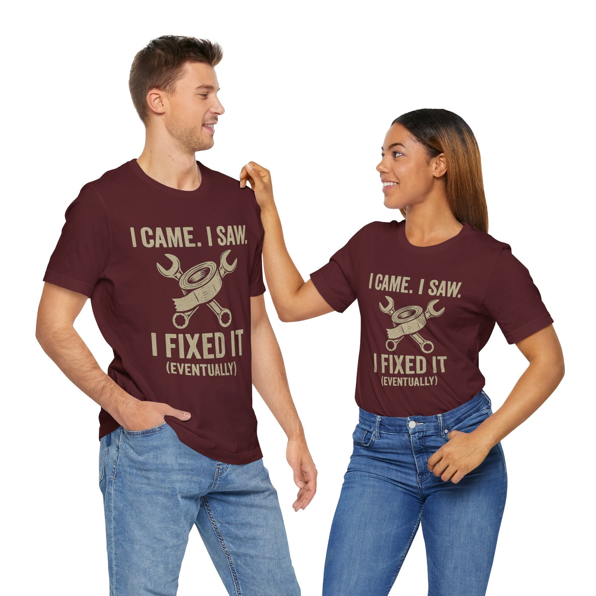 Pair of maroon graphic T-shirts with “I came. I saw. I fixed it (eventually)” tool icon print