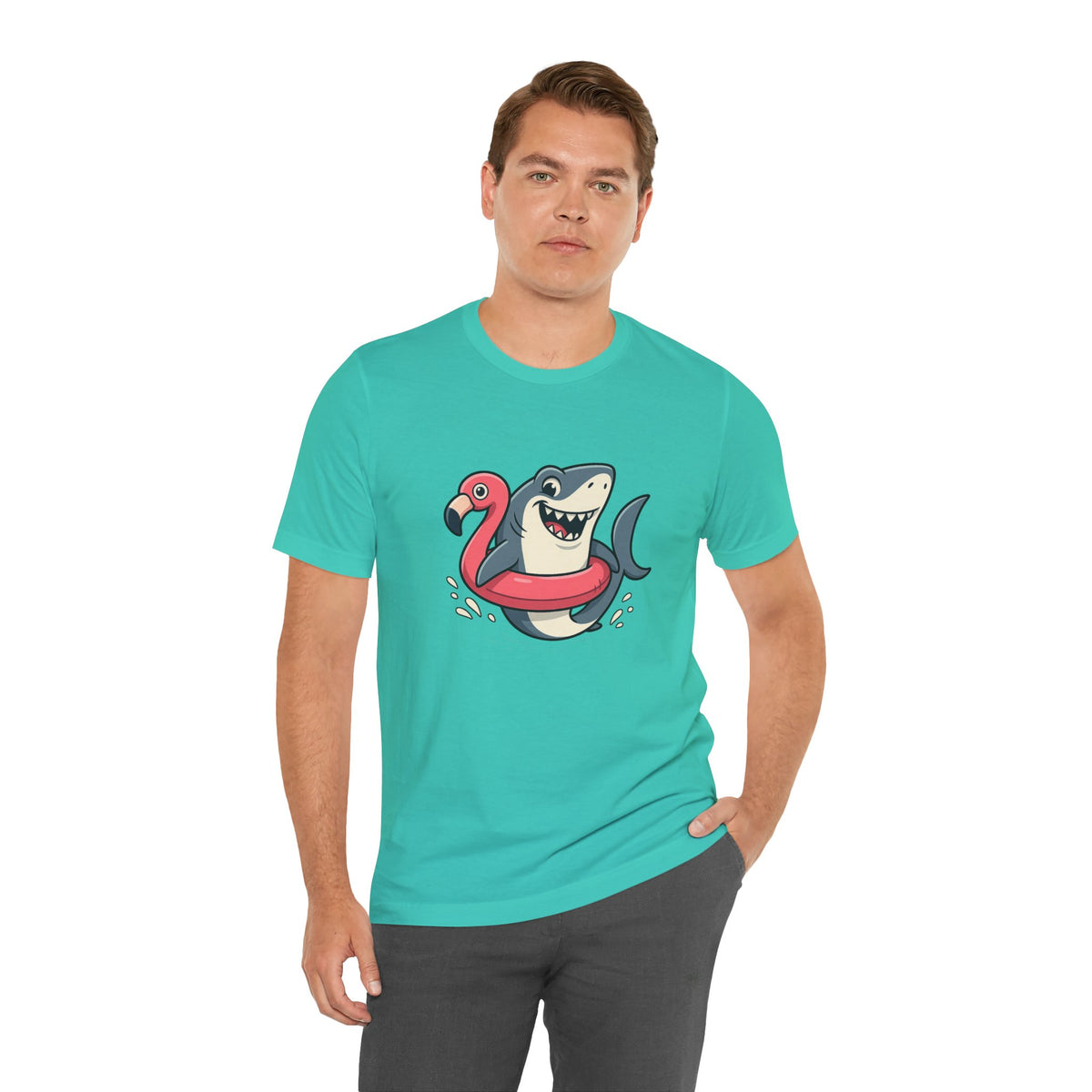 Teal crew-neck T-shirt with shark and flamingo floatie graphic, worn by man