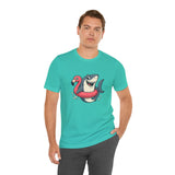Teal crew-neck T-shirt with shark and flamingo floatie graphic, worn by man