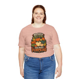 Blush pink crew-neck t-shirt with front pumpkin graphic, model smiling