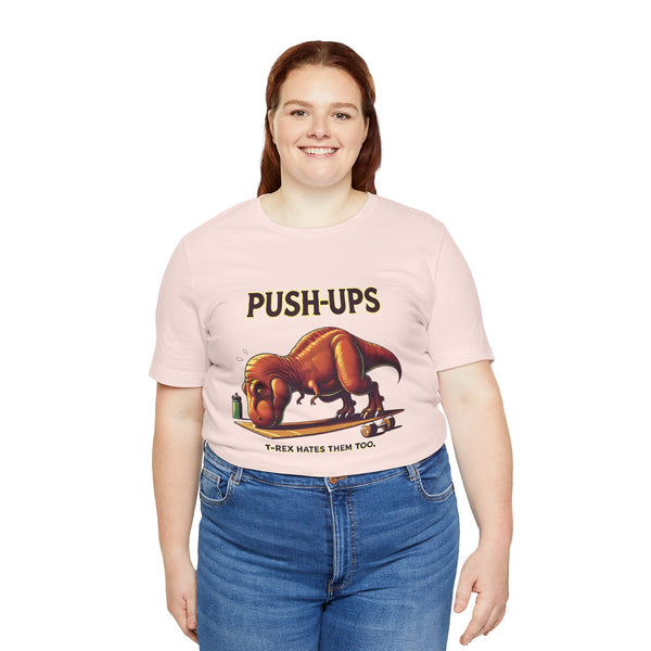 Pink crew-neck T-shirt with “PUSH-UPS” headline and T-Rex push-up illustration
