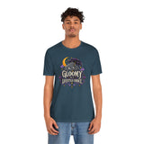 Deep teal crew-neck T-shirt with colorful goth cat and moon “Gloomy” graphic front