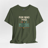 Olive green crew-neck T-shirt with “Recovery is required” graphic