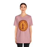 Dusty pink T-shirt with round gold Greek-style figure graphic on the chest