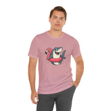 Pink short-sleeve crew-neck T-shirt with shark holding flamingo floatie graphic