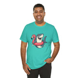 Teal crew-neck T-shirt featuring shark and flamingo floatie graphic, front view