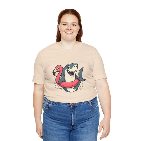 Cream crew-neck t-shirt with shark and flamingo graphic, front worn by woman