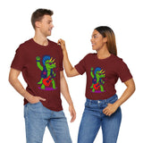 Two people wearing burgundy dinosaur punk-rocker graphic T-shirts with triceratops guitarist