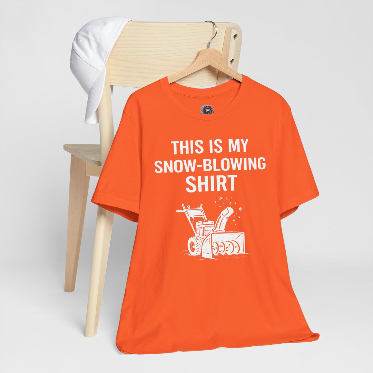 Orange crew-neck T-shirt with “This is my snow-blowing shirt” graphic and snowblower