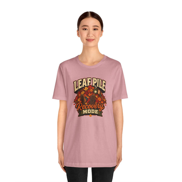 Light pink T-shirt with leaf-pile “Recovery Mode” chest graphic