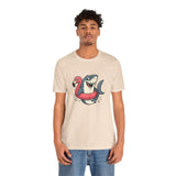 Cream crew-neck t-shirt with shark and flamingo graphic, worn by man